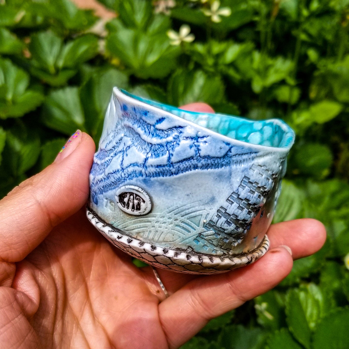 Handmade stoneware ceramic soda fired cup blue color with pressed textures