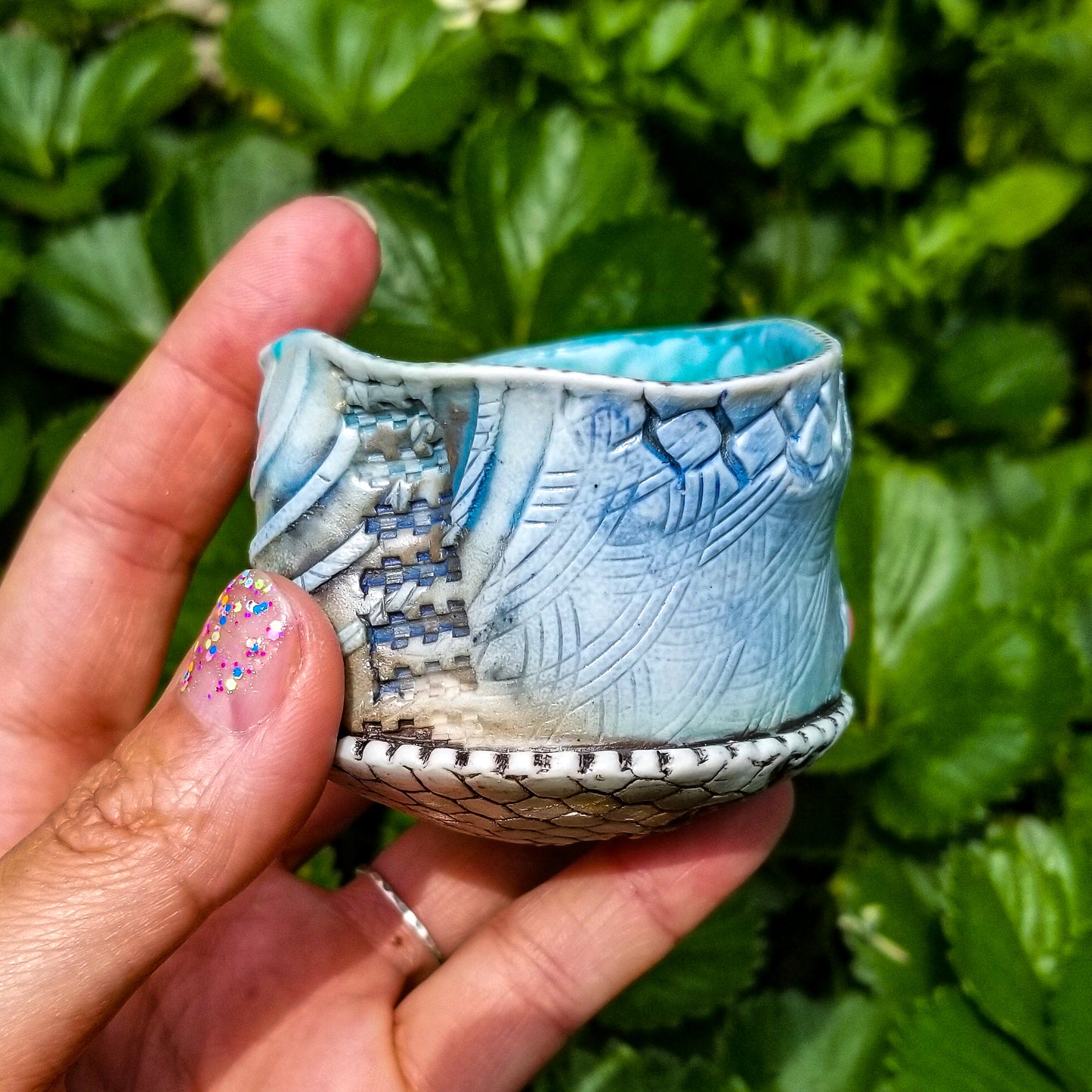 Handmade stoneware ceramic soda fired cup blue color with pressed textures
