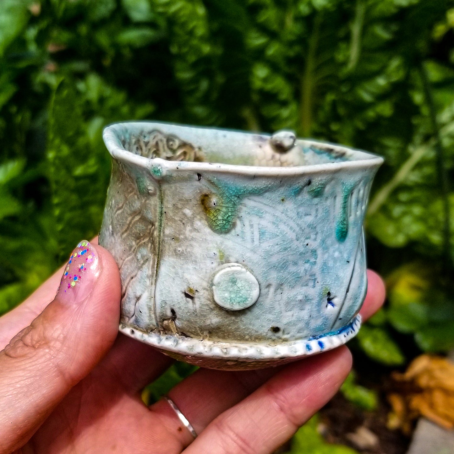 Handmade stoneware ceramic soda fired cup blue color with pressed textures