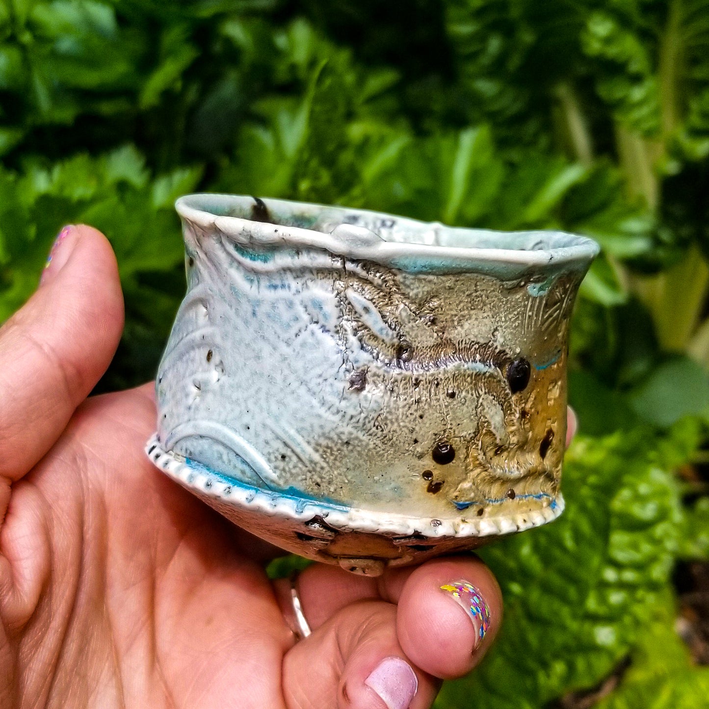 Handmade stoneware ceramic soda fired cup blue color with pressed textures