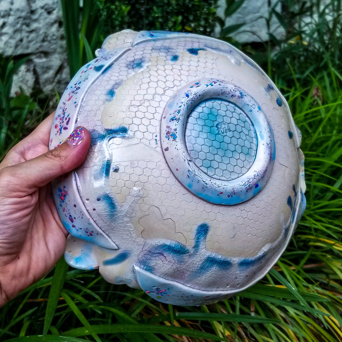 Bottom detail of handmade ceramic soda fired serving bowl multi color with pressed textures