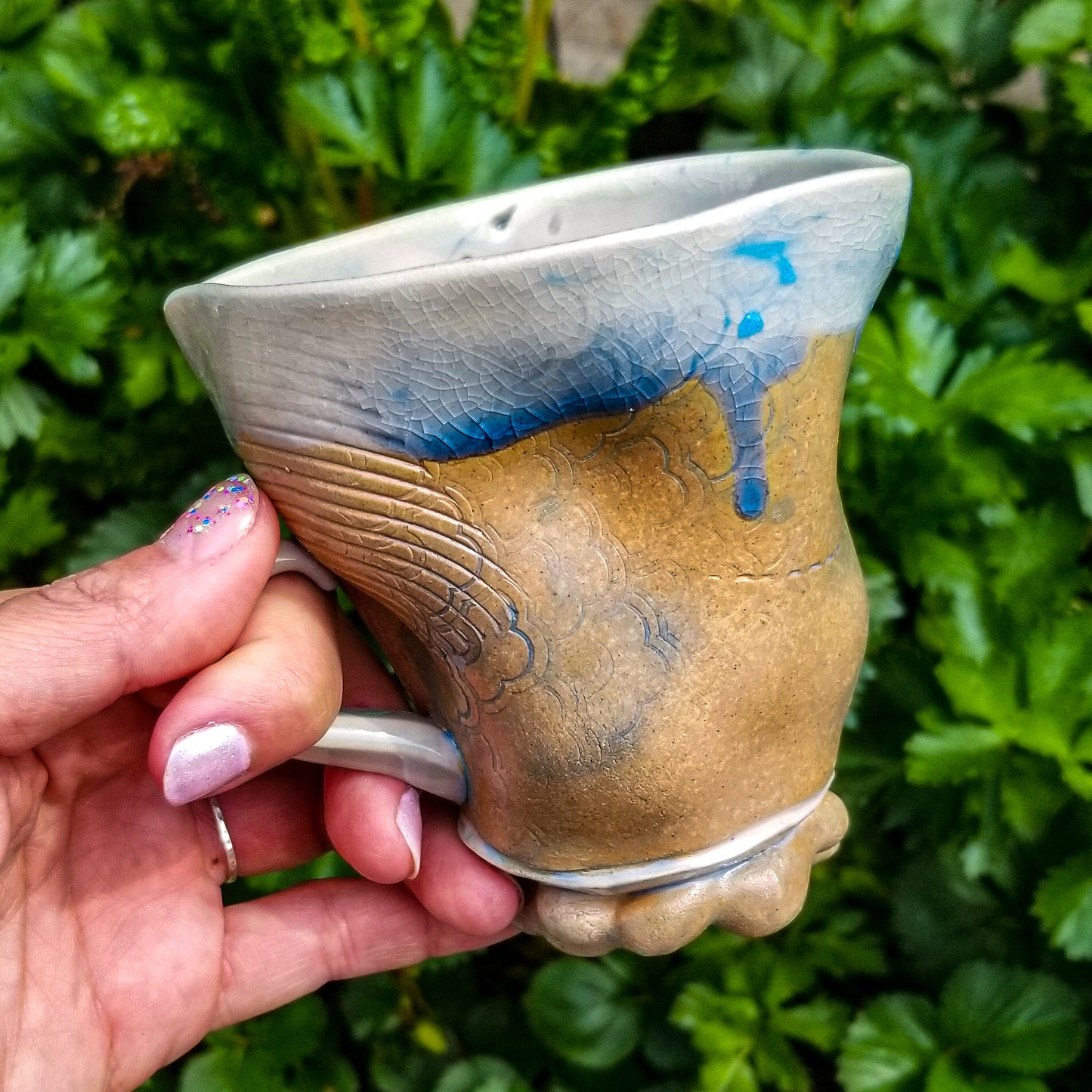 Handmade stoneware ceramic soda fired mug blue color with pressed textures
