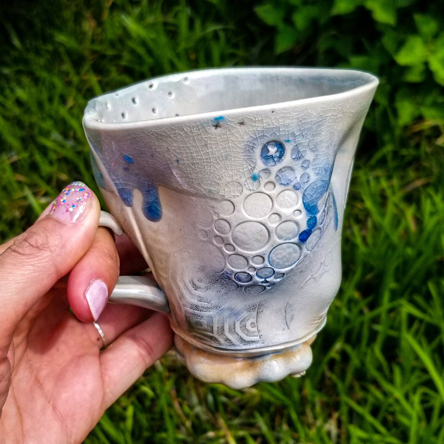 Handmade stoneware ceramic soda fired mug blue color with pressed textures