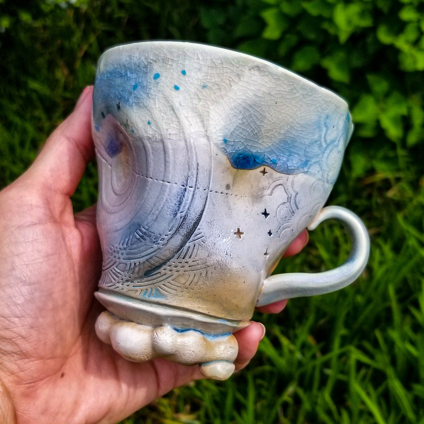 Handmade stoneware ceramic soda fired mug blue color with pressed textures