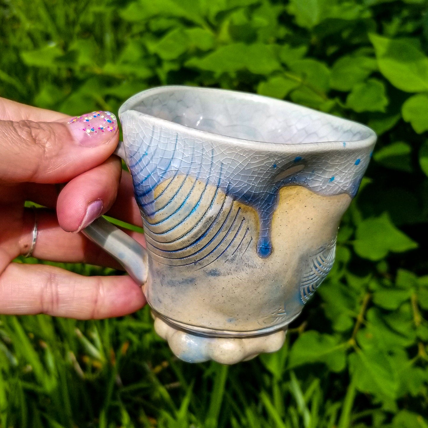Handmade stoneware ceramic soda fired mug blue color with pressed textures