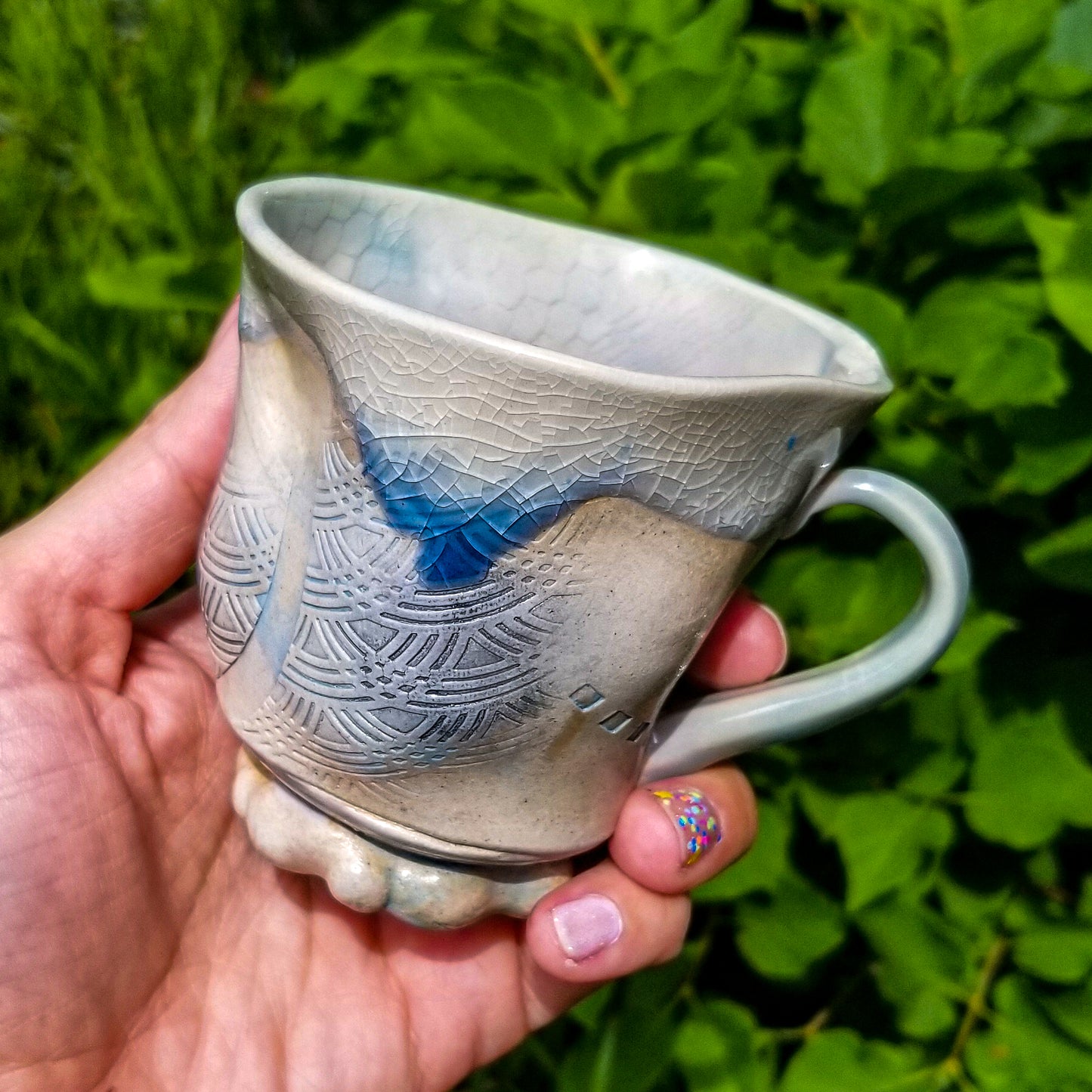 Handmade stoneware ceramic soda fired mug blue color with pressed textures