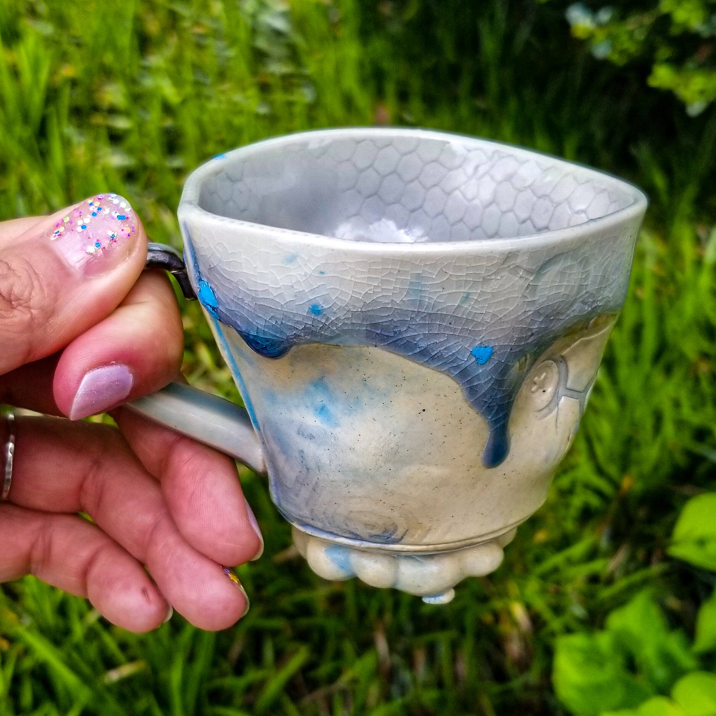 Handmade stoneware ceramic soda fired mug blue color with pressed textures