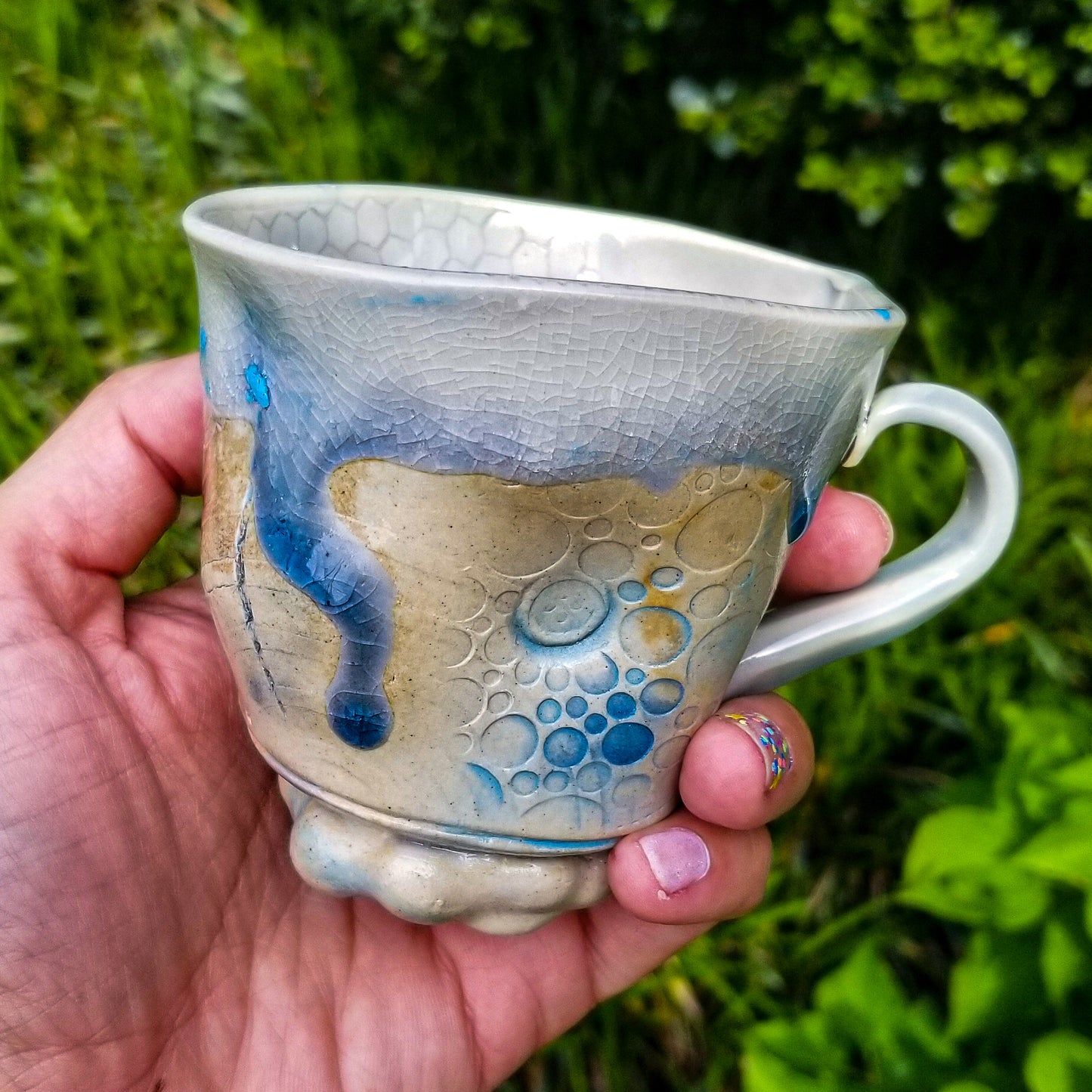 Handmade stoneware ceramic soda fired mug blue color with pressed textures