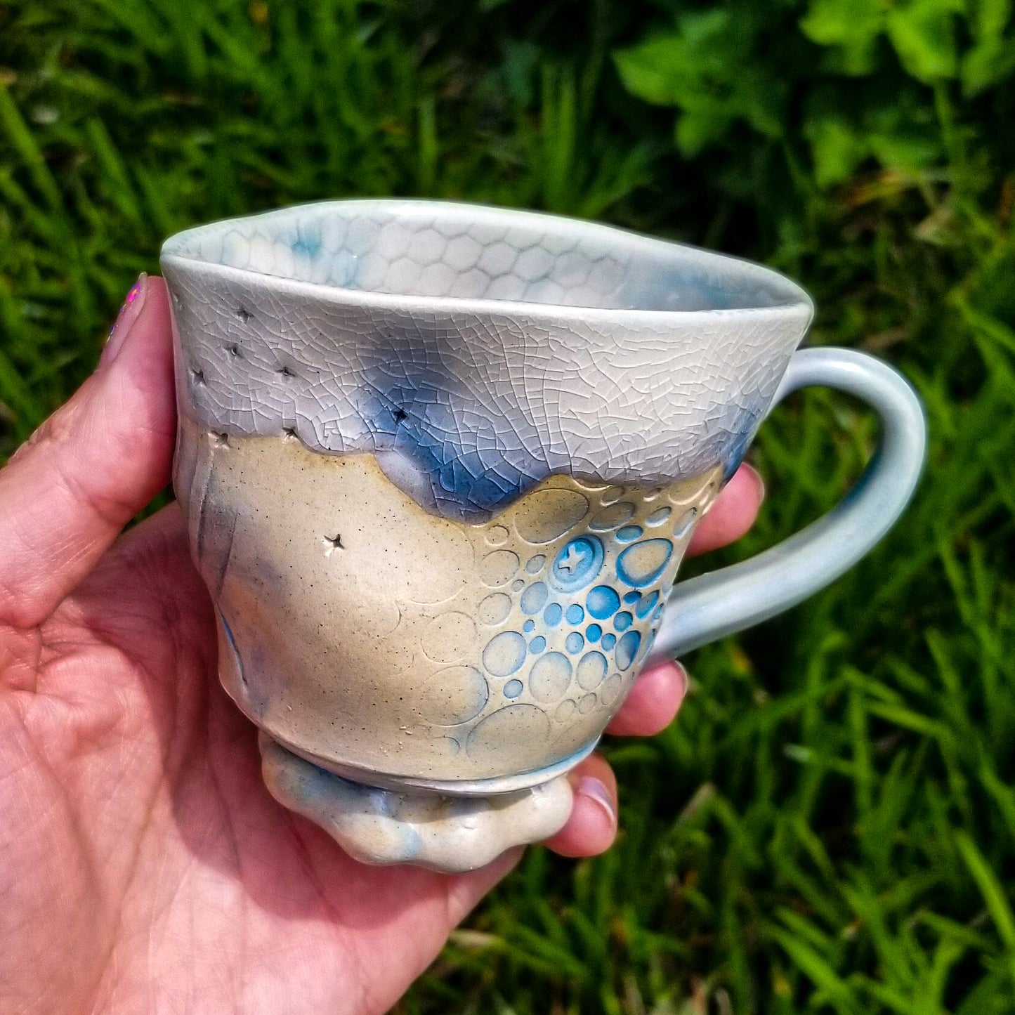 Handmade stoneware ceramic soda fired mug blue color with pressed textures