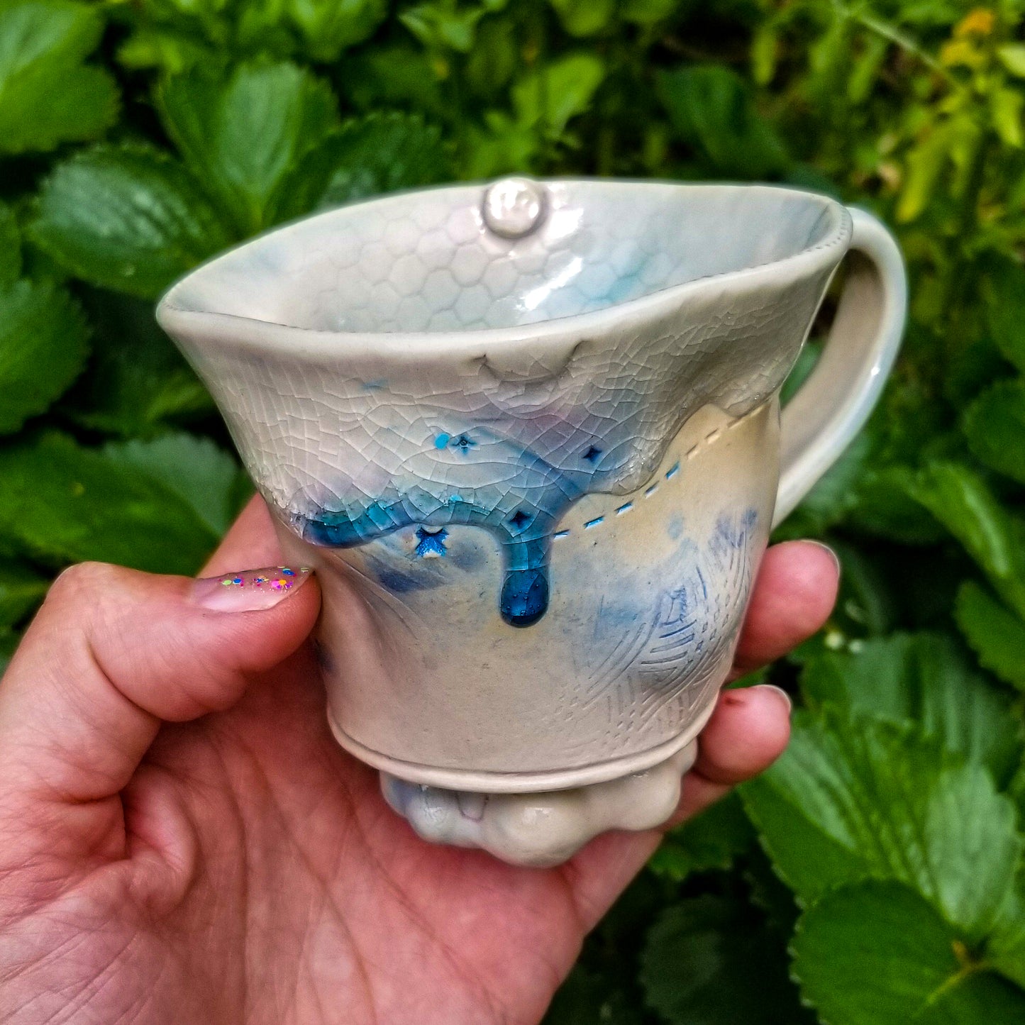Handmade stoneware ceramic mug blue color with pressed textures