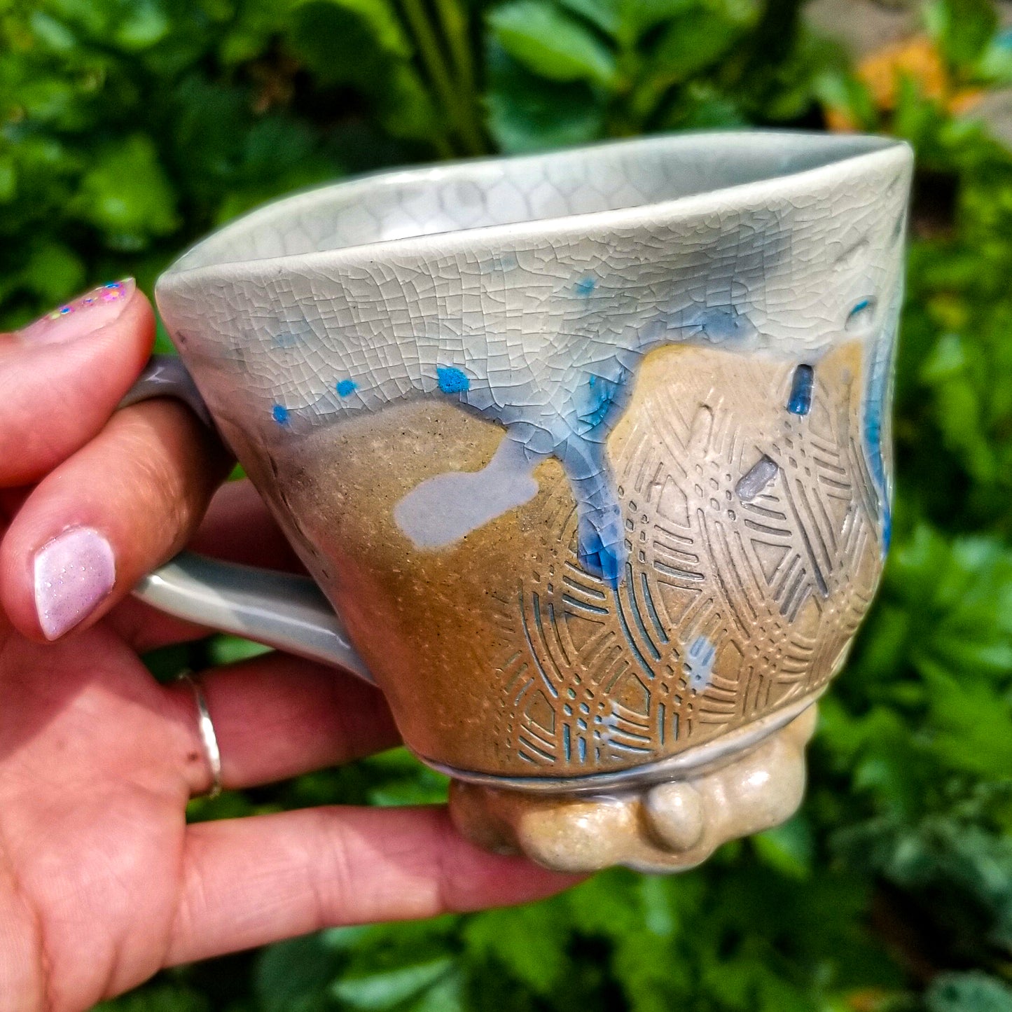 Handmade stoneware ceramic soda fired mug blue color with pressed textures