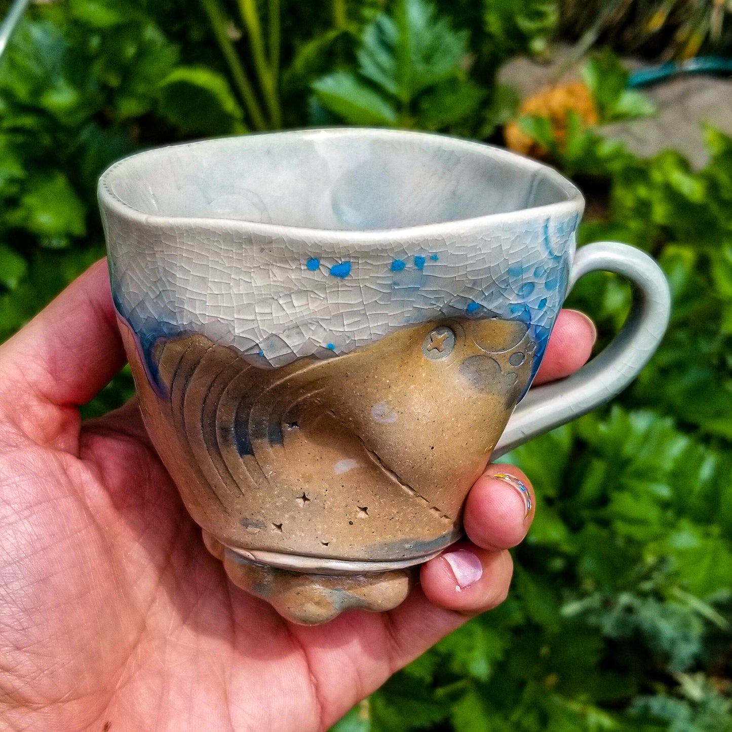 Handmade stoneware ceramic soda fired mug blue color with pressed textures