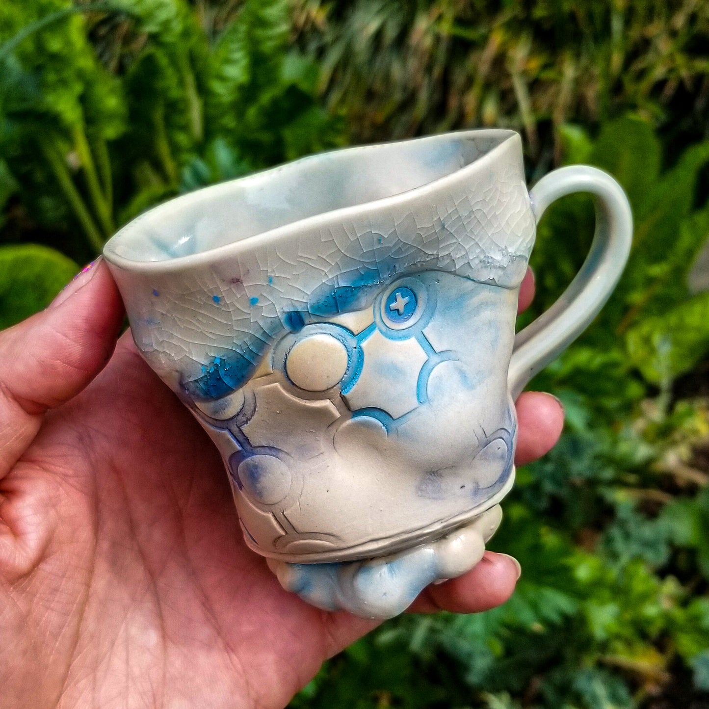 Handmade stoneware ceramic mug blue color with pressed textures