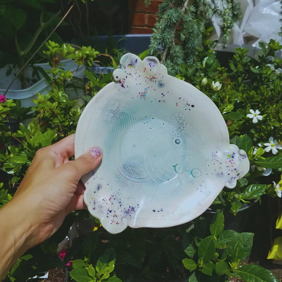 Video of handmade ceramic soda fired plate multi color with pressed textures