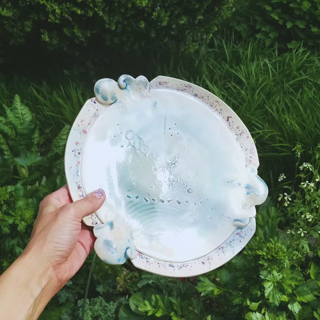 Video of handmade ceramic soda fired platter multi color with pressed textures