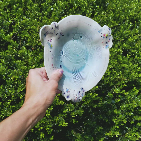 Video of handmade ceramic soda fired plate multi color with pressed textures