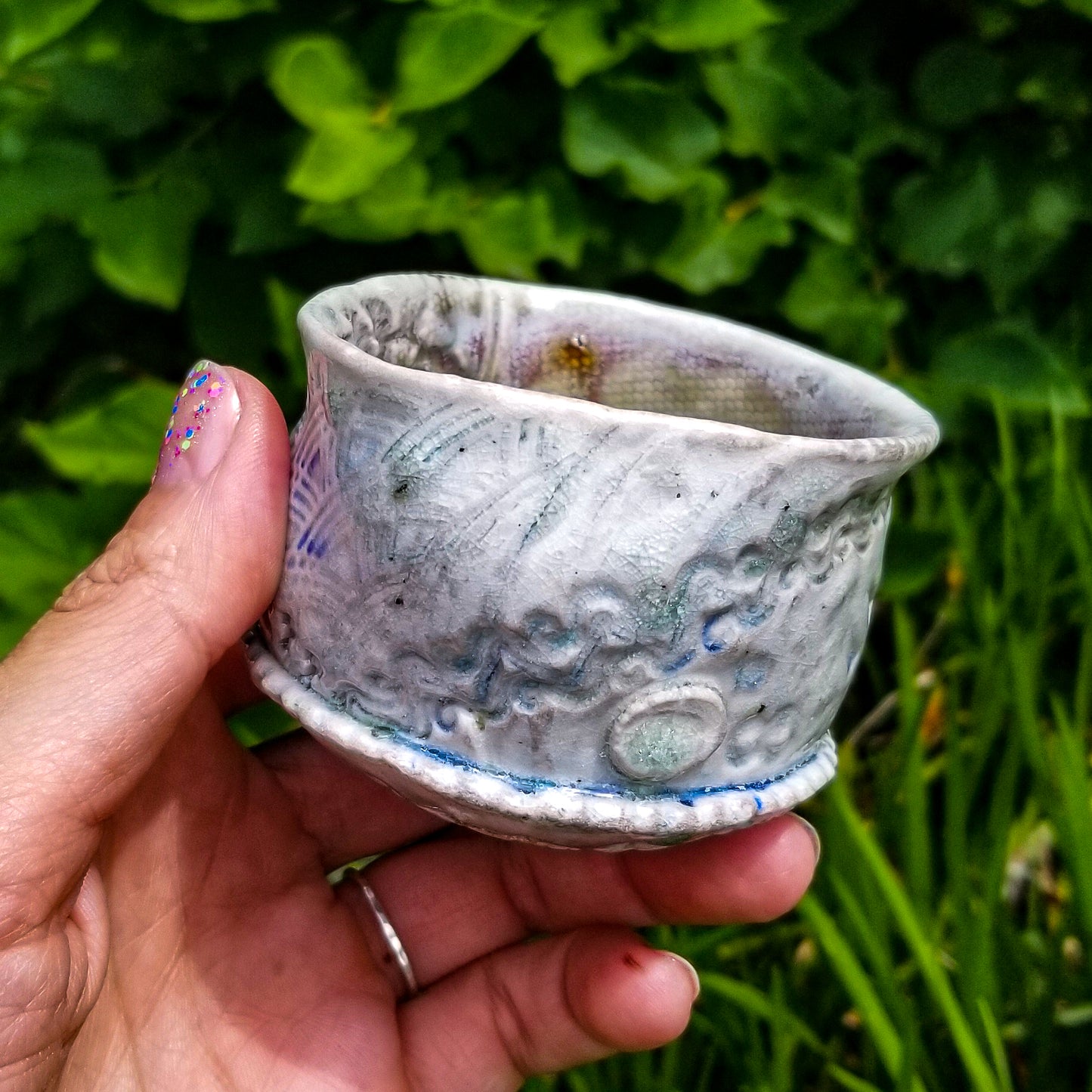 Handmade stoneware ceramic soda fired cup blue color with pressed textures