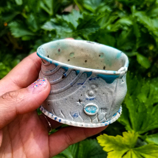 Handmade stoneware ceramic soda fired cup blue color with pressed textures