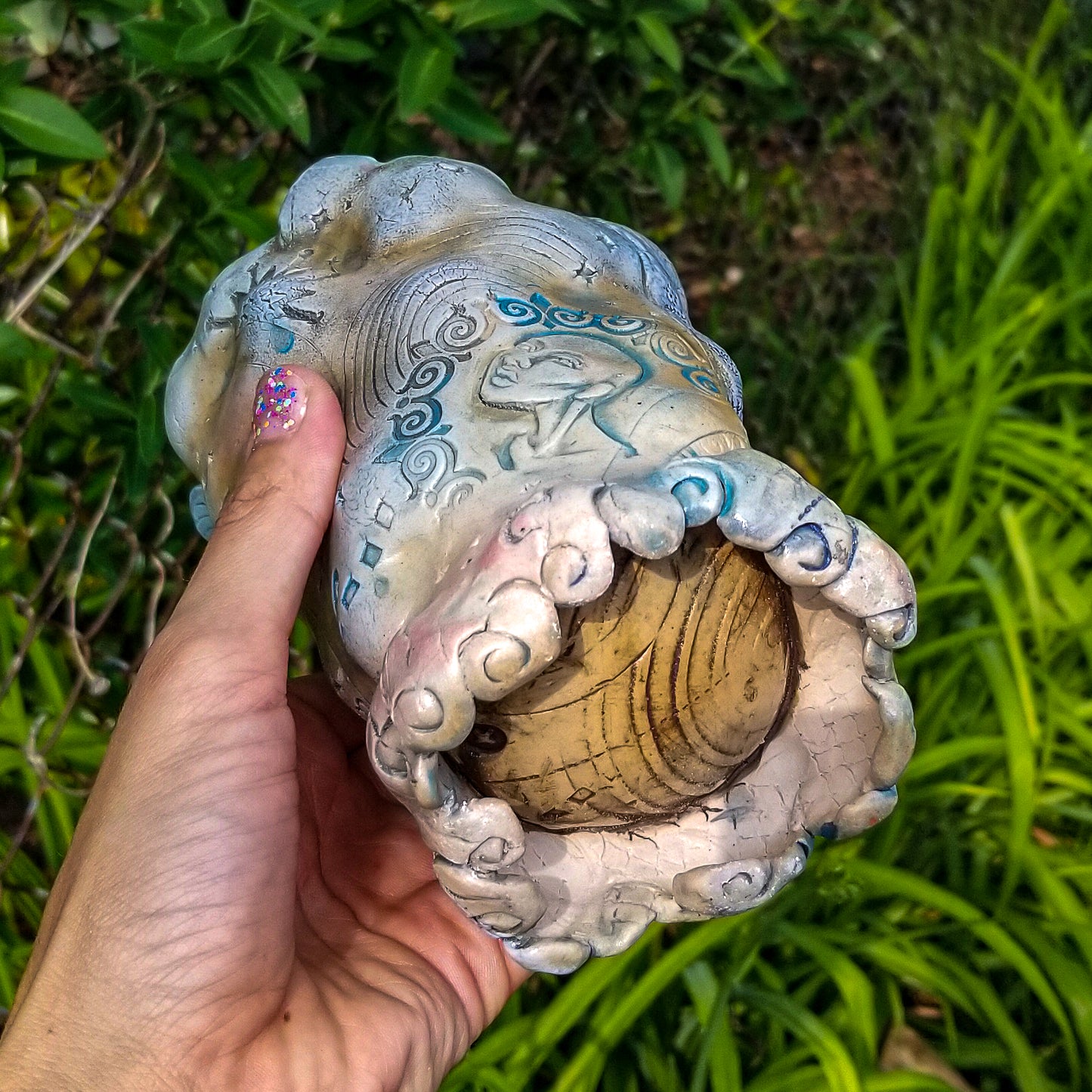 Bottom detail of handmade stoneware ceramic soda fired vase multi color with pressed textures