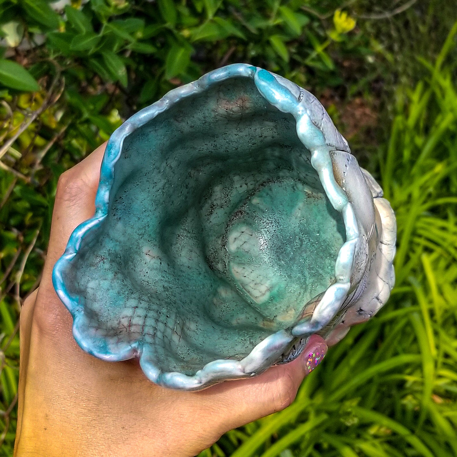Inside detail of handmade stoneware ceramic soda fired vase multi color with pressed textures