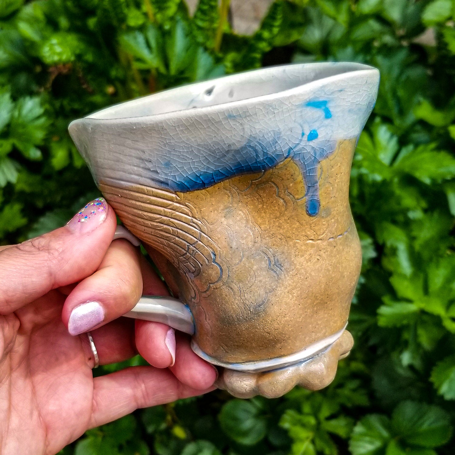 Handmade stoneware ceramic soda fired mug blue color with pressed textures