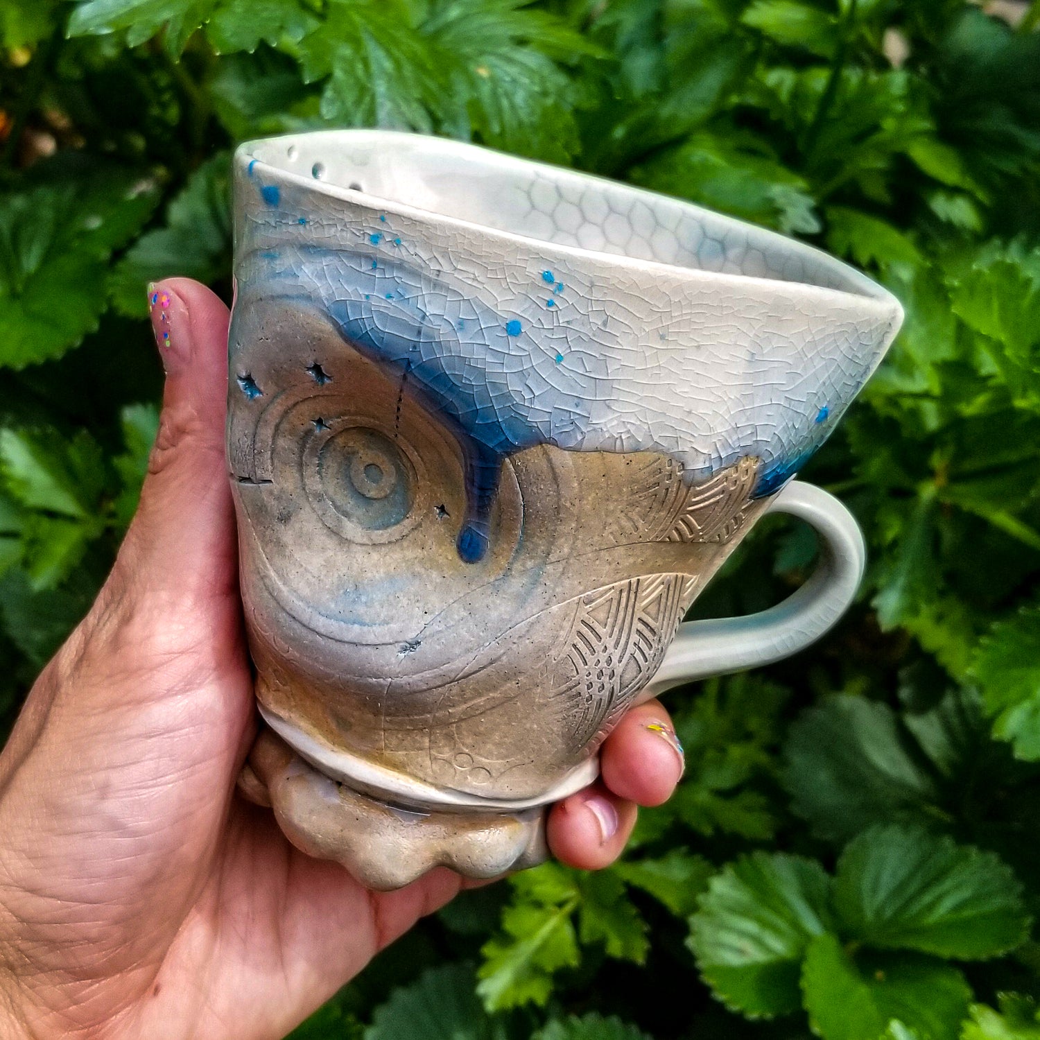Handmade stoneware ceramic soda fired mug blue color with pressed textures
