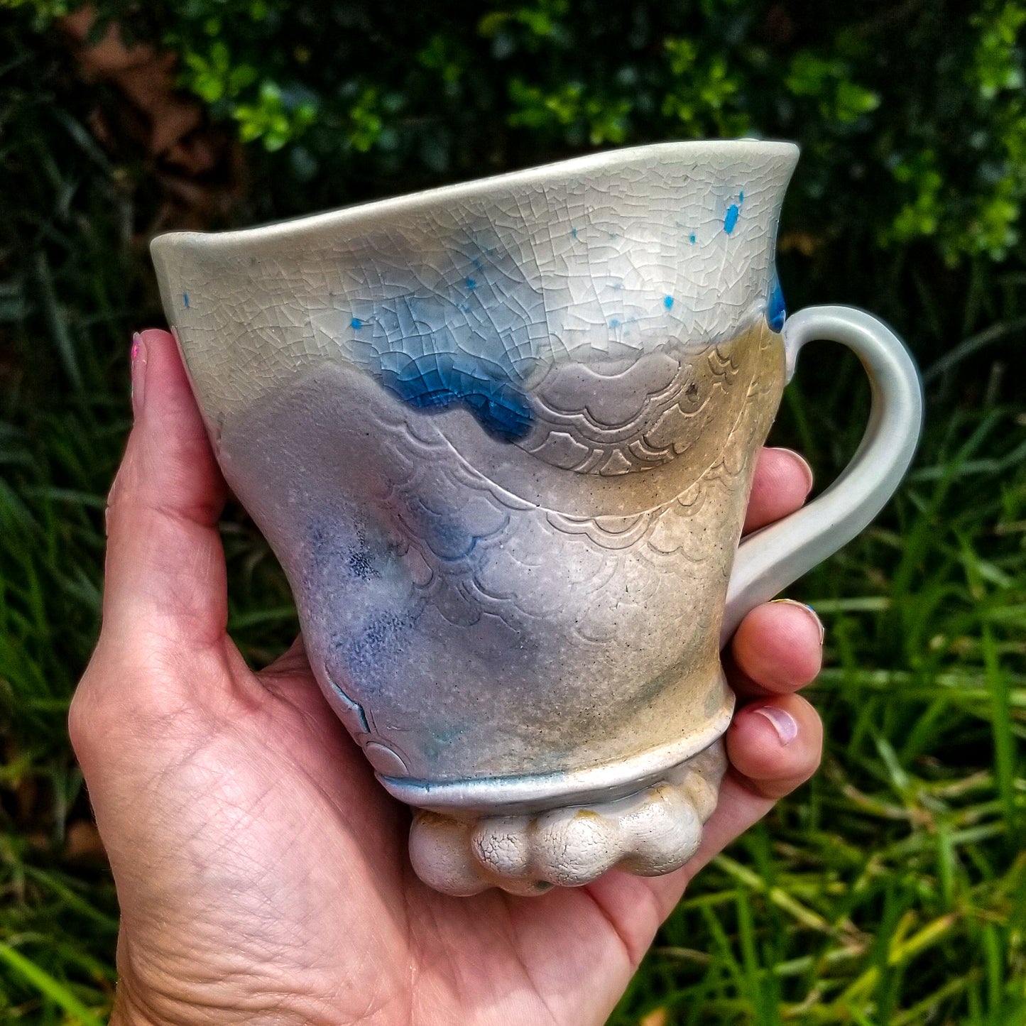 Handmade stoneware ceramic soda fired mug blue color with pressed textures