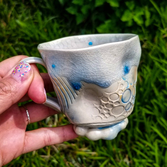Handmade stoneware ceramic soda fired mug blue color with pressed textures