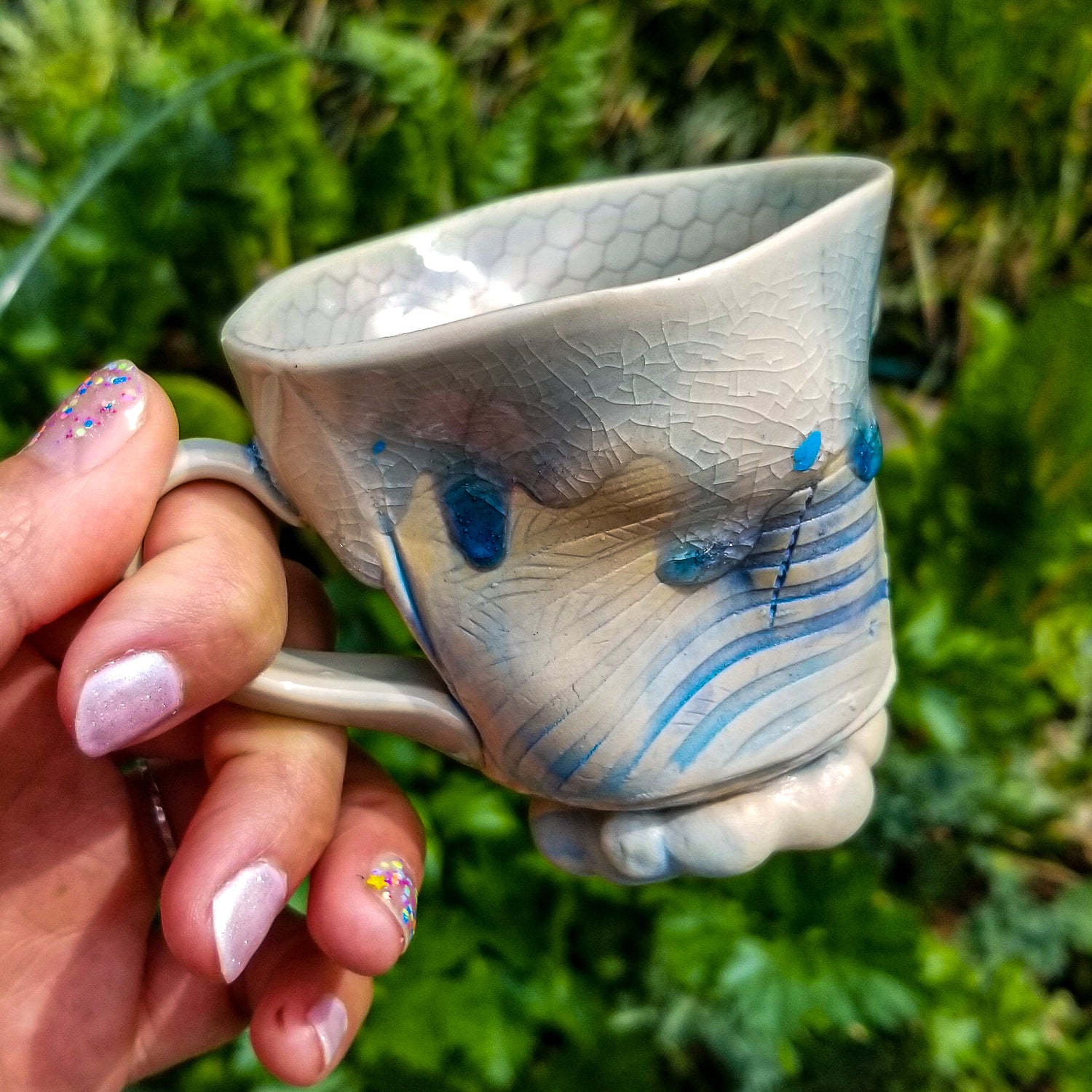 Handmade stoneware ceramic mug blue color with pressed textures