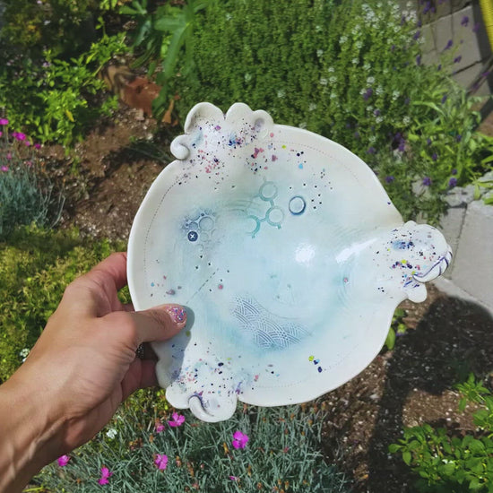 Video of handmade ceramic soda fired dish multi color with pressed textures