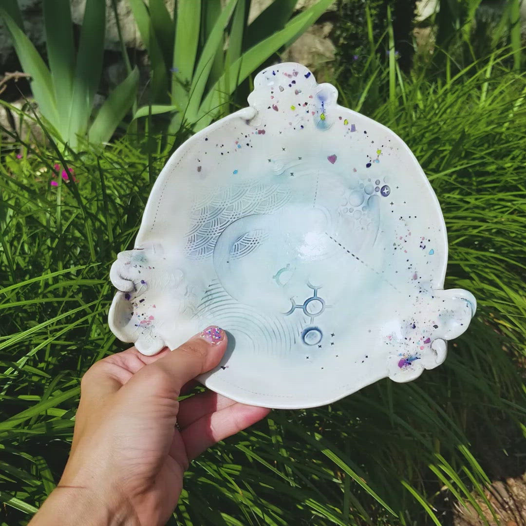 Video of handmade ceramic soda fired dish multi color with pressed textures