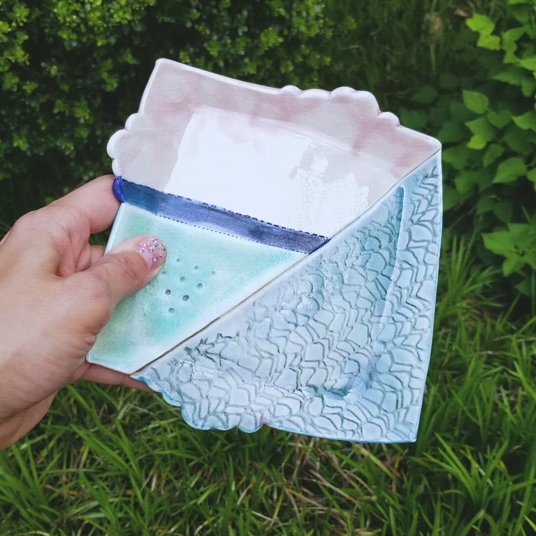 Video of handmade porcelain ceramic soda fired dish multi color with pressed textures