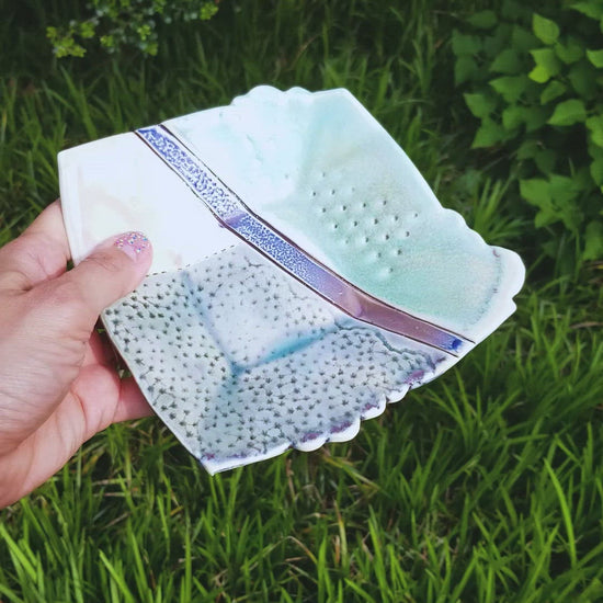 Video of handmade porcelain ceramic soda fired dish multi color with pressed textures